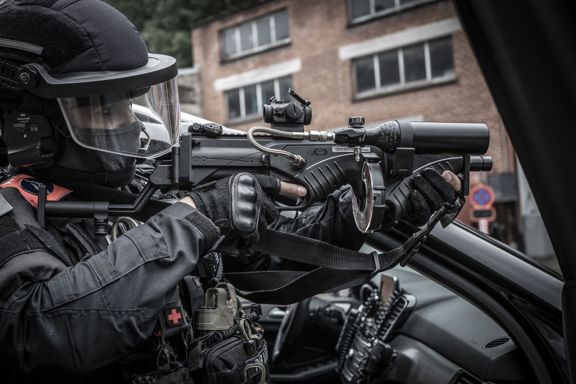 police officer holding an fn 303 