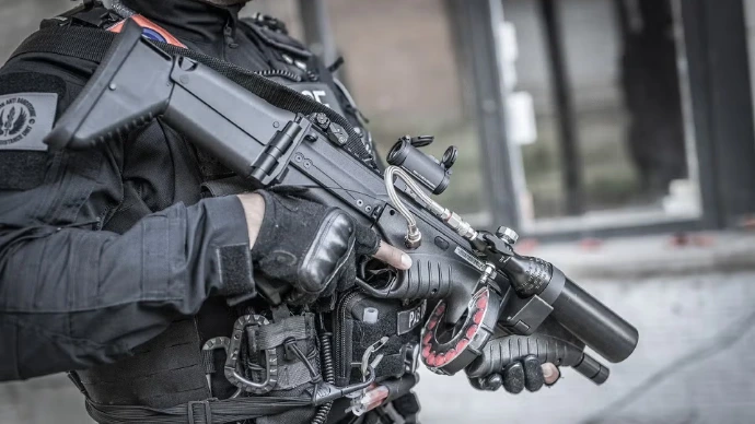 police officer holding a fn 303