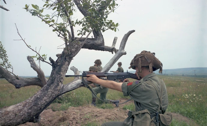 a soldier holding an fn C1 rifle